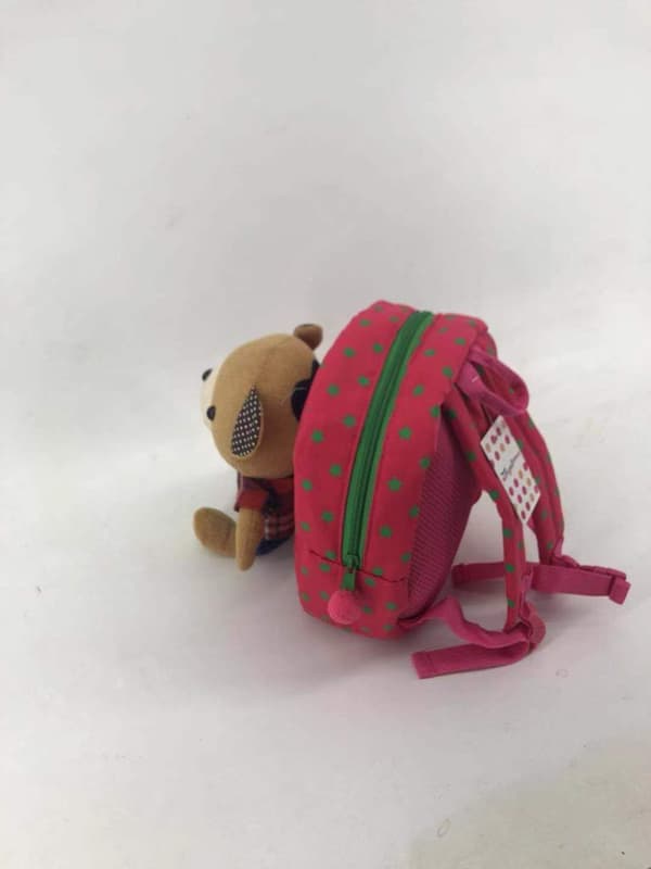 Lapsen reppu nalleturvahihnalla – pinkki