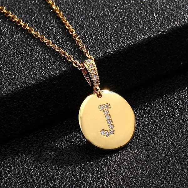 Round letter amulets in gold and zircon gold-plated necklaces