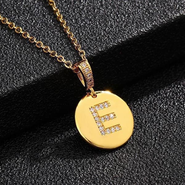Round letter amulets in gold and zircon gold-plated necklaces