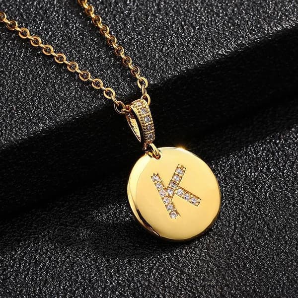 Round letter amulets in gold and zircon gold-plated necklaces