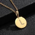 Miniatyrbilde 1 av 9: Round letter amulets in gold and zircon gold-plated necklaces